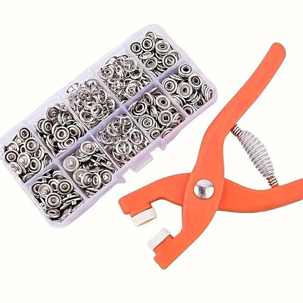 An orange precision snap button kit containing various silver-toned buttons arranged in a plastic tray.