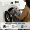 A person is placing a gray sofa cover into a white washing machine for easy care.