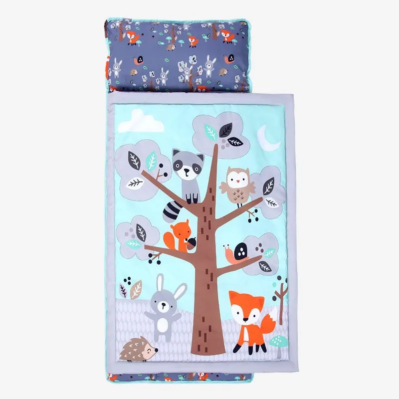 Toddler nap mat set featuring a fabric pillow and fleece blanket with woodland animal designs