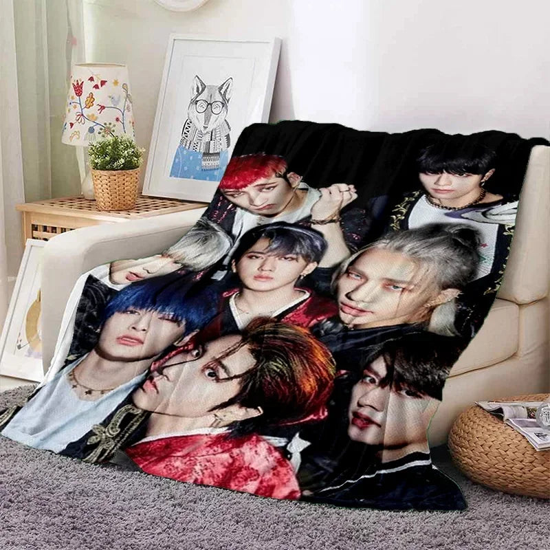 A fleece throw blanket featuring a 3D print of Stray Kids Kpop members in various poses.