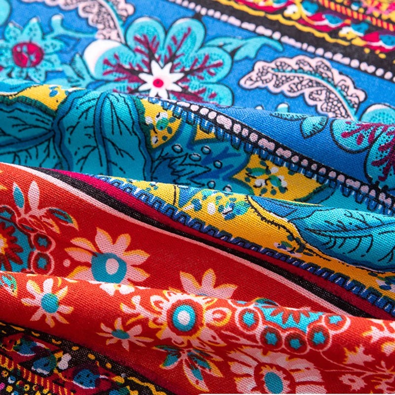 Close-up of colorful bohemian printed linen fabric showing various floral patterns and vibrant colors