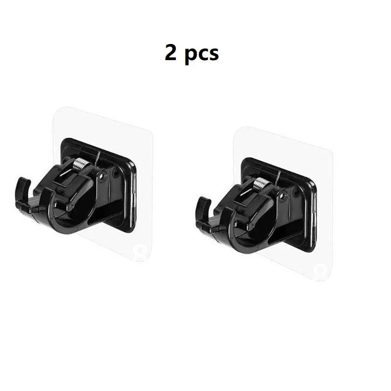 Two black non-drill curtain rod brackets for walls.