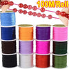 Rolls of multicolor elastic beading cord in various colors like blue, orange, purple, pink, and green.