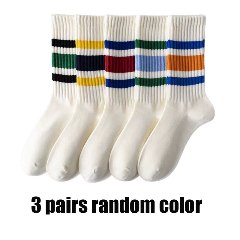 Three pairs of men's retro striped crew socks featuring multicolored horizontal stripes.