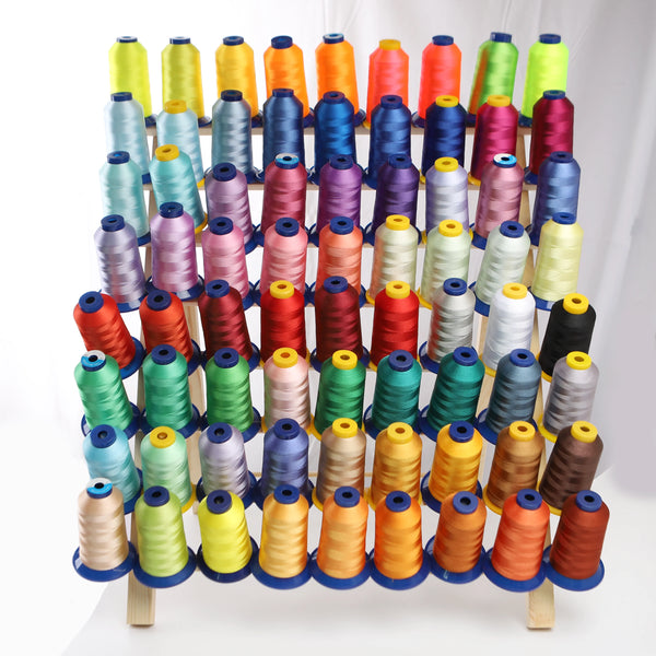 A collection of various colored high tenacity polyester embroidery threads arranged in vertical rows.