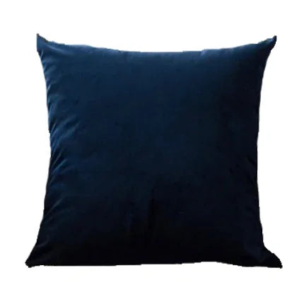 A dark navy blue velvet throw pillow cover resting on a white background.