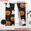 Two black curtain panels featuring orange Halloween pumpkins and white ghosts printed on a dark fabric.