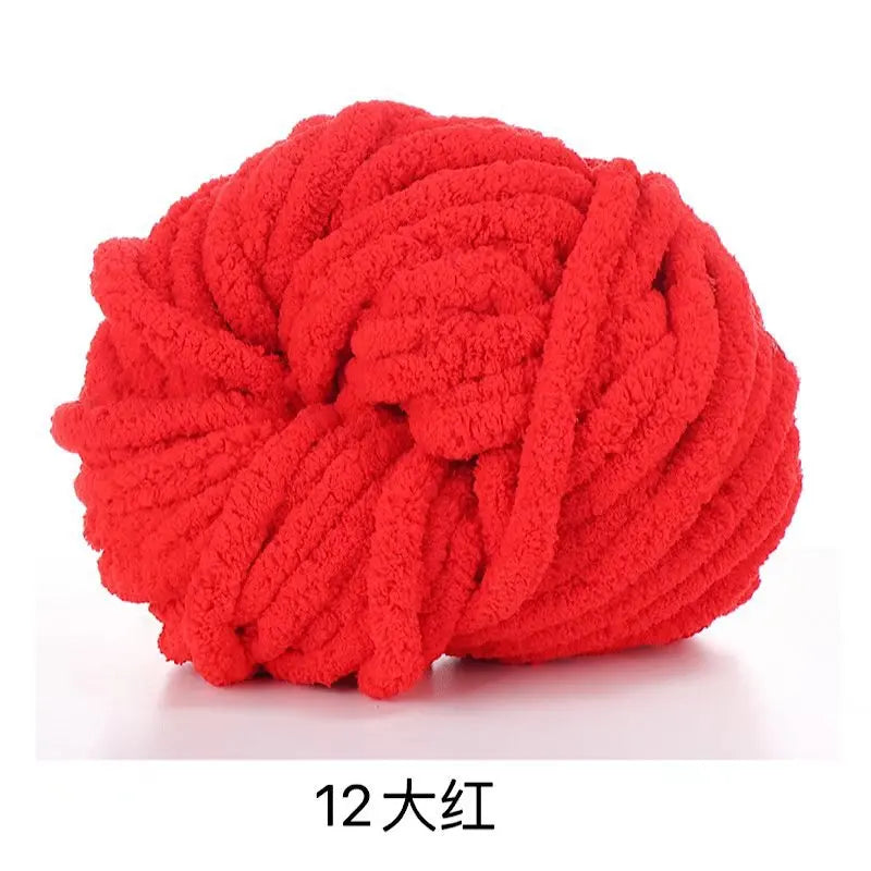 A ball of bright red chunky chenille yarn.