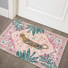 Pink tiger and tropical palm leaf non-slip entryway rug on a wooden floor.