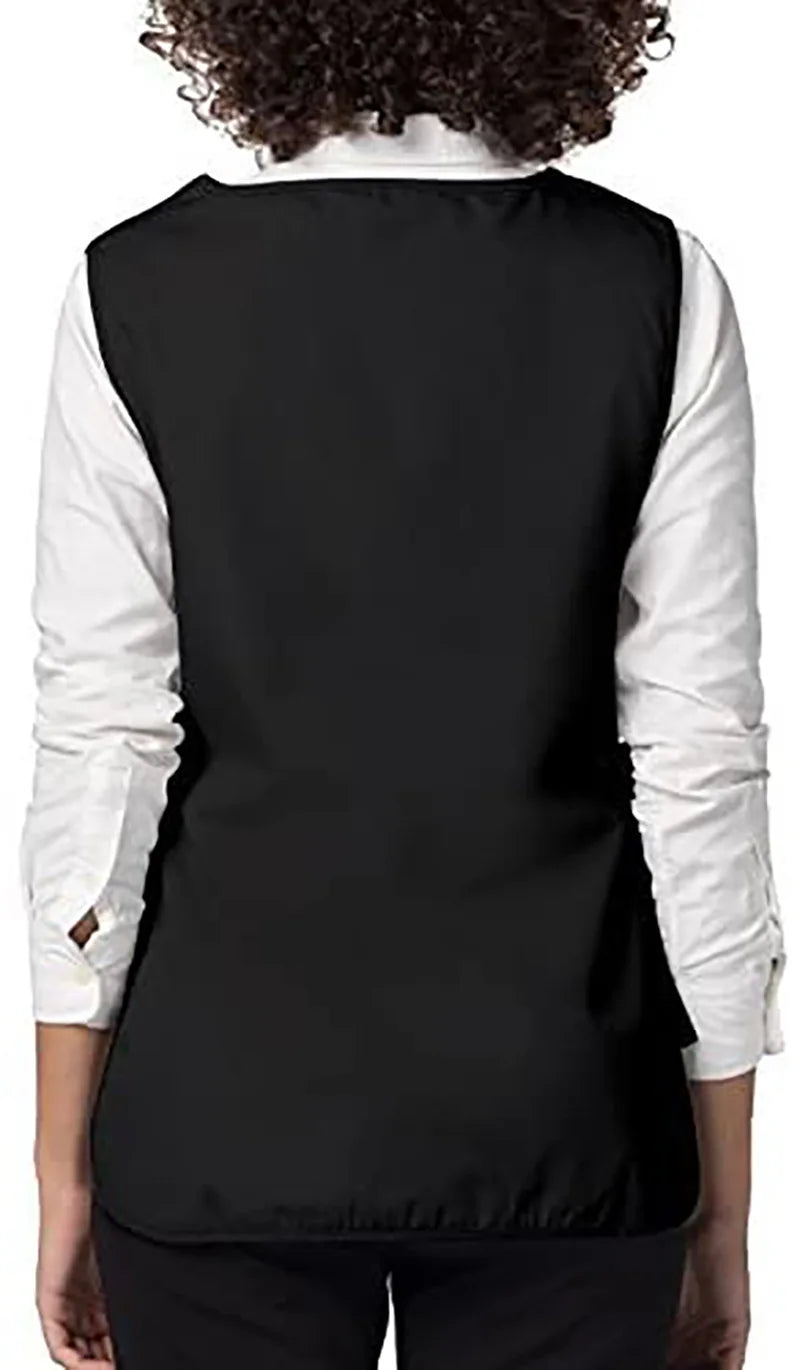 Back view of a black versatile polyester apron worn over a white shirt.