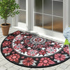 A semi-circular mosaic floor mat with a vintage floral print featuring pink, white, and black patterns.