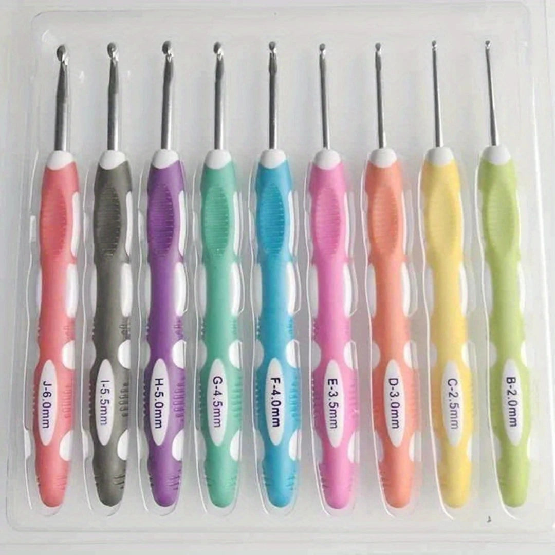A set of ergonomic crochet hooks and needles in various colors and sizes packaged in a clear plastic case.