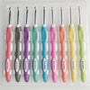 A set of ergonomic crochet hooks and needles in various colors and sizes displayed in a clear plastic case.