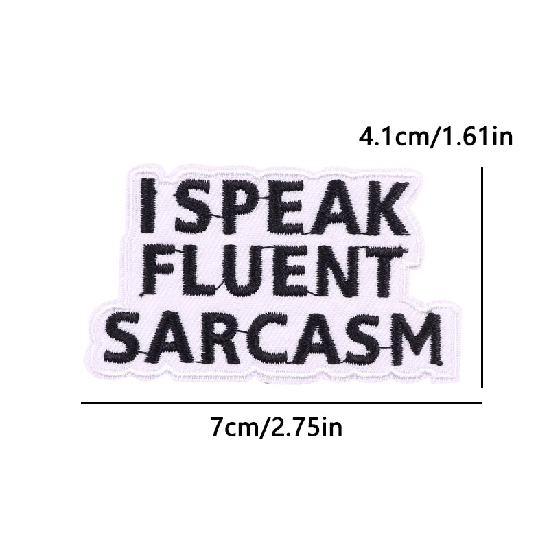 Black embroidered patch with the text I SPEAK FLUENT SARCASM