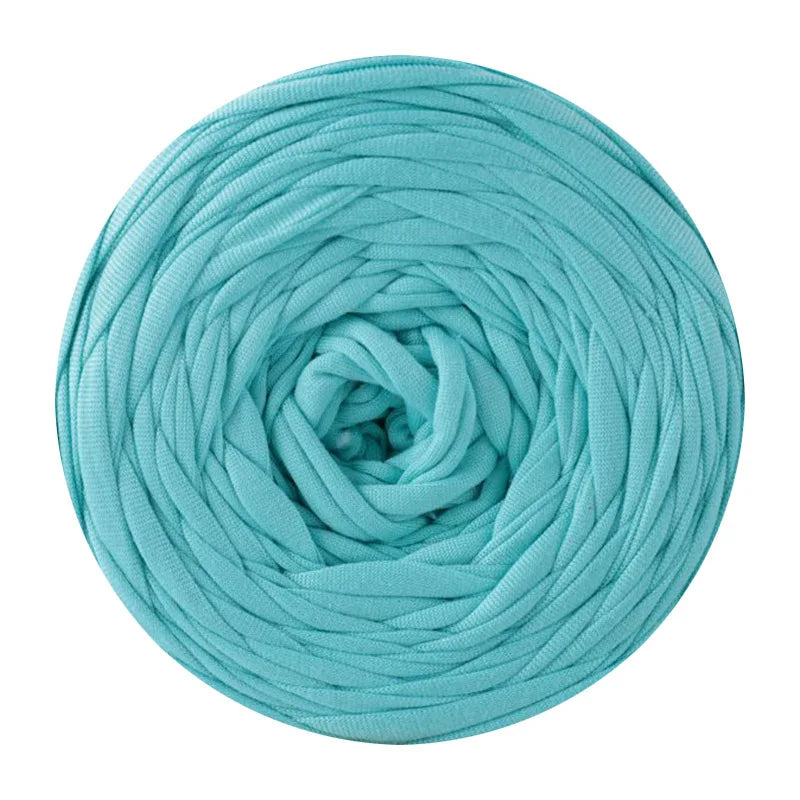 A ball of teal blue soft T-shirt yarn for crochet