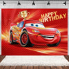 A cartoon racing car with a gold trophy is featured on a red birthday party backdrop.