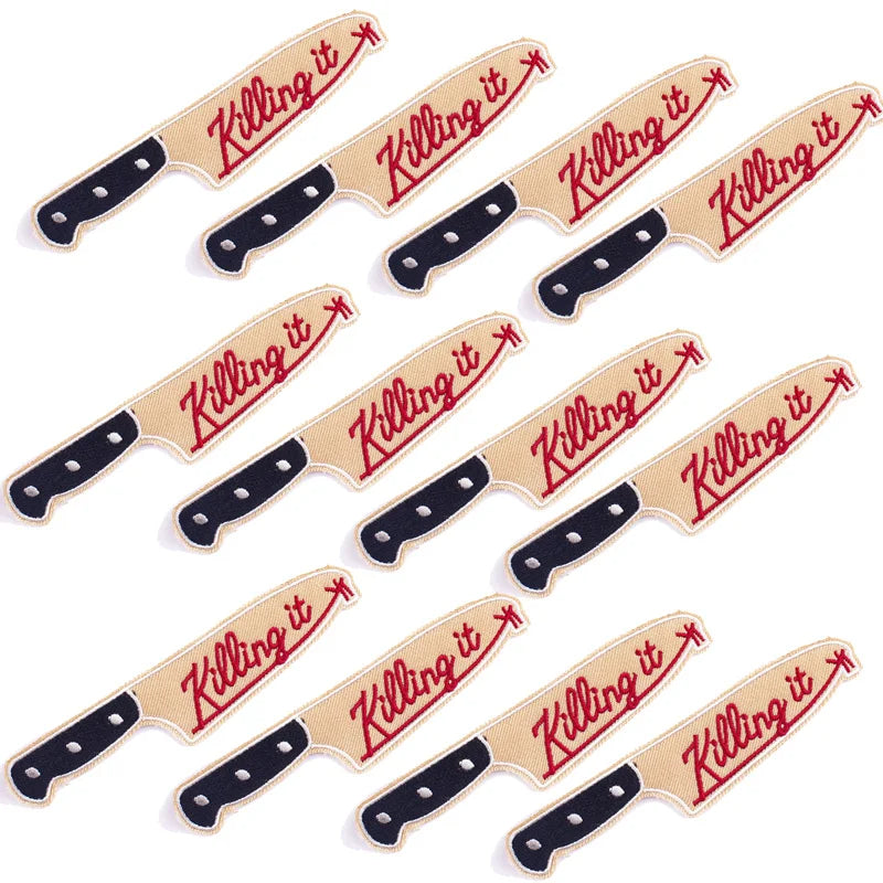 A set of DIY punk embroidery patches with the text Killing it on a tan fabric background.