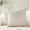 A white textured corduroy throw pillow cover with a diagonal quilted pattern.