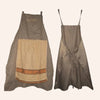 A sleeveless olive green apron with a large rectangular pocket featuring an orange trim.