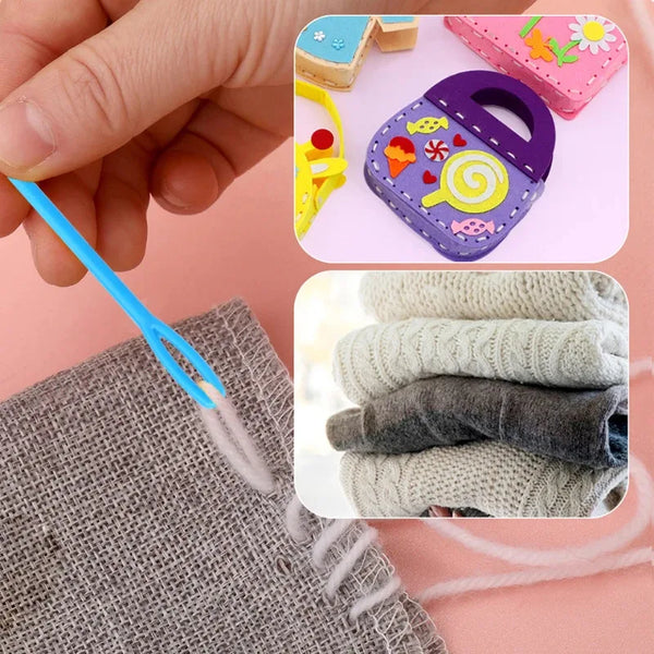A hand holds a blue knitting needle next to a kit featuring a purple fabric tool and several gray knitted items.