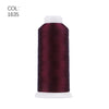 A roll of deep burgundy polyester embroidery thread with a white core.