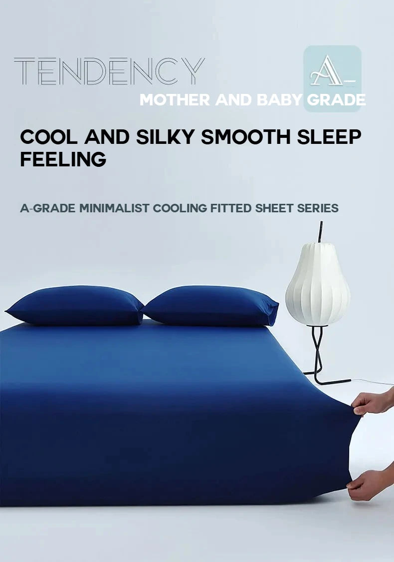 A set of dark blue, silky smooth cooling fitted bed sheets for mother and baby grade.