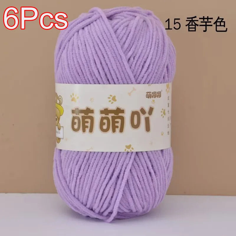 A skein of 6 purple chenille yarn labeled with Chinese characters for crochet and knitting.