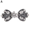 Vintage swirl clip brooch featuring silver-toned metal and clear rhinestones designed for scarves and clothing.