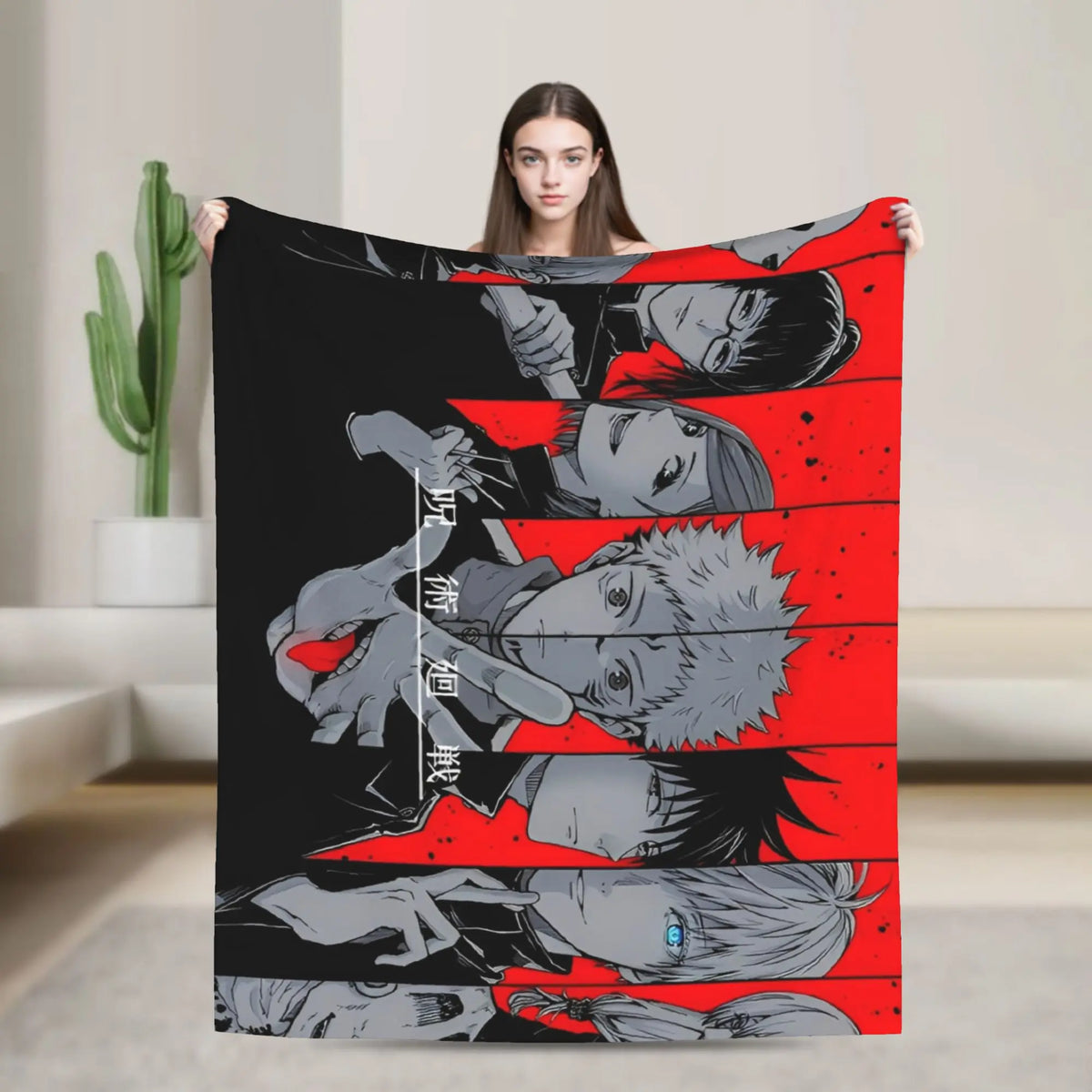 A person holds up a black and red flannel throw blanket featuring multiple stylized characters from Jujutsu Kaisen.