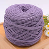 Purple craft yarn wound into a thick ball for knitting and DIY projects