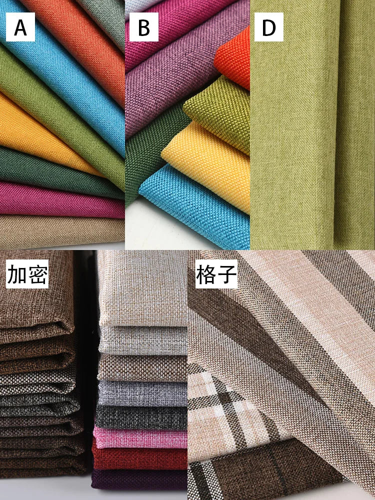 A collection of various colored linen and cotton fabrics shown in rolled stacks.