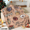 A beige flannel throw blanket featuring Christmas and winter-themed designs like candy canes and geometric shapes.