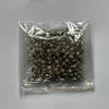 A clear plastic bag containing a set of small, round metal buckle clamps.