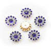 Five clusters of round blue and clear rhinestones on a gold-toned base.