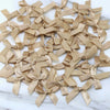 A collection of small, light beige satin ribbon bows for crafts and decor.