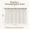 Cream sheer kitchen curtain featuring a ruffled skirt and ribbon ties for an oven door.