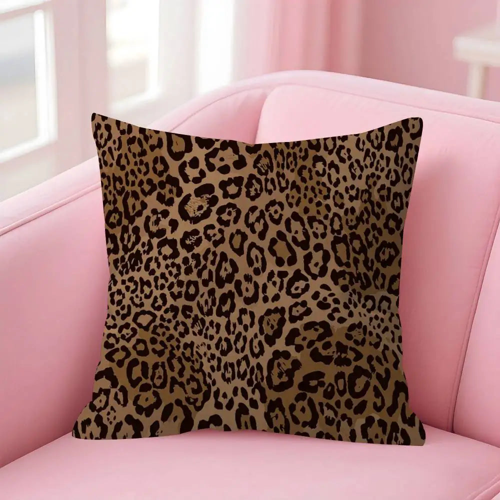 A brown leopard print decorative pillow cover resting on a pink sofa.