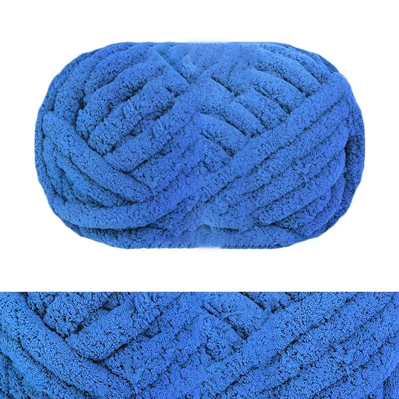 A close-up view of a bright blue hand-knitted wool finger line scarf with a textured, braided pattern.