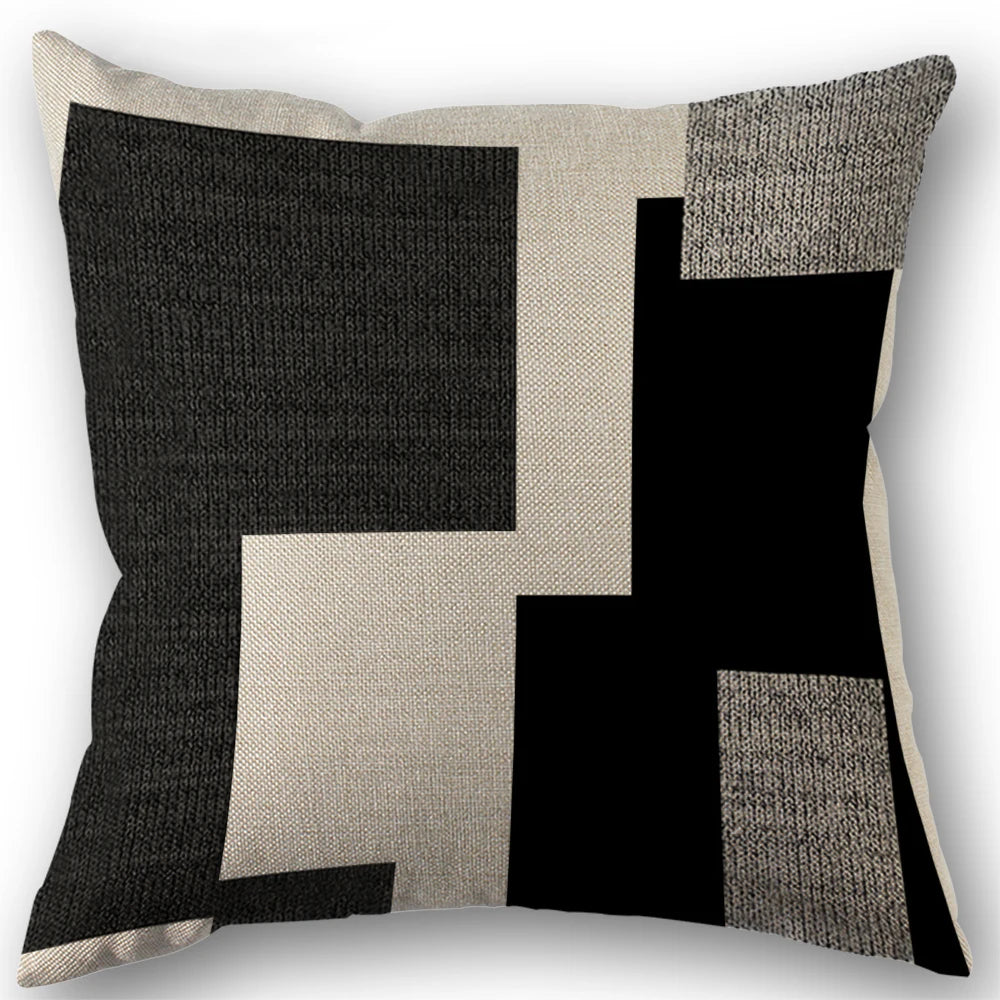 Abstract geometric throw pillow covers featuring black and beige blocks in a modern boho style