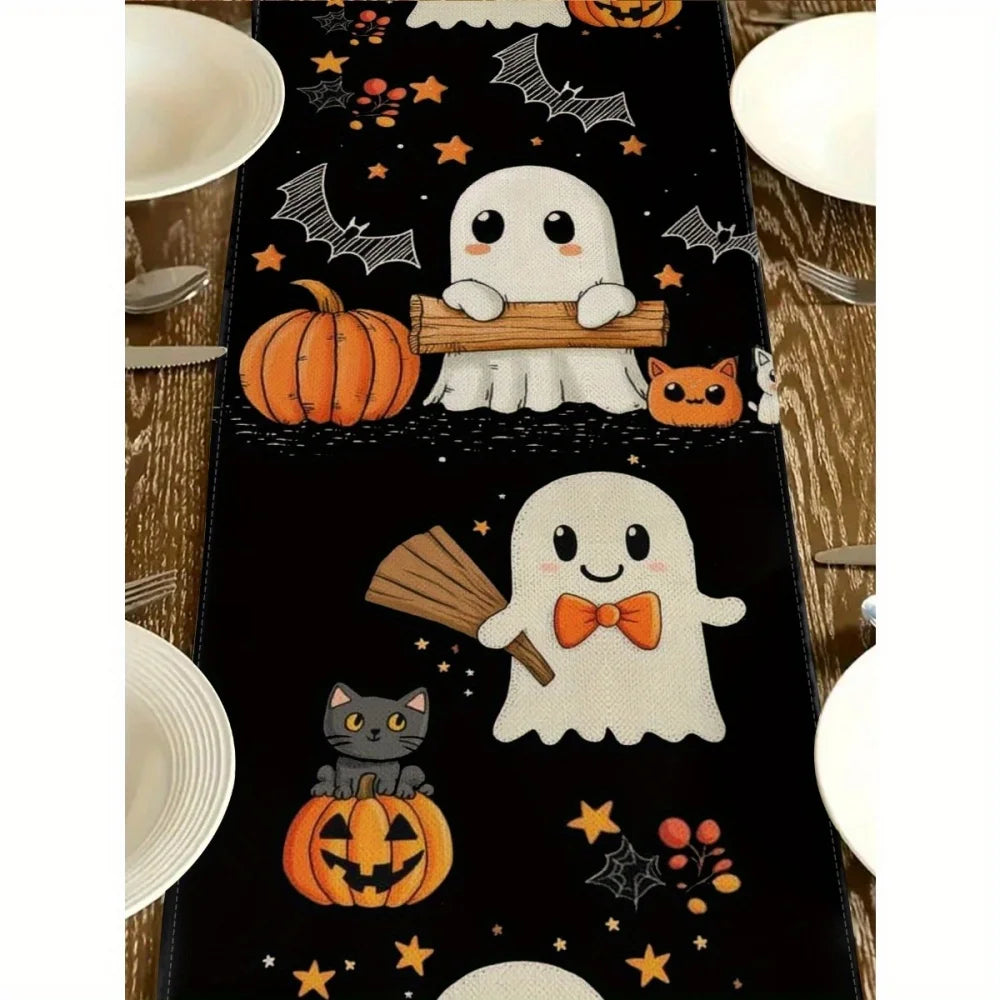 Black Halloween table runner featuring a design with pumpkins, bats, and cats.