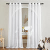 White semi-sheer tulle curtains hanging on a rod in a room with an arched doorway.