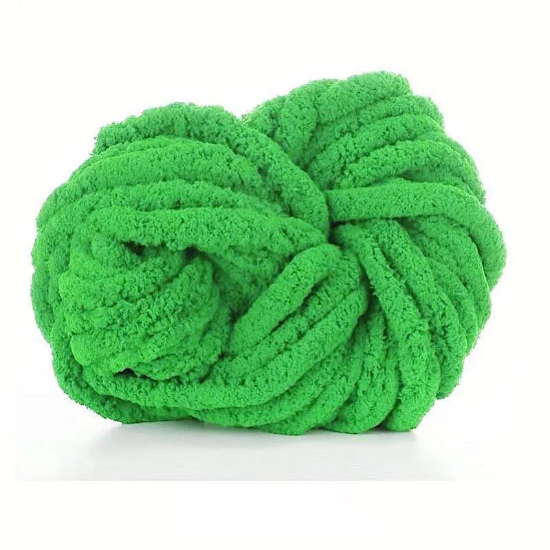 A ball of bright green chunky acrylic yarn for knitting and crochet projects.