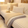 A white plush anti-slip sofa seat cushion cover with vertical pleats and a layered, textured fabric.