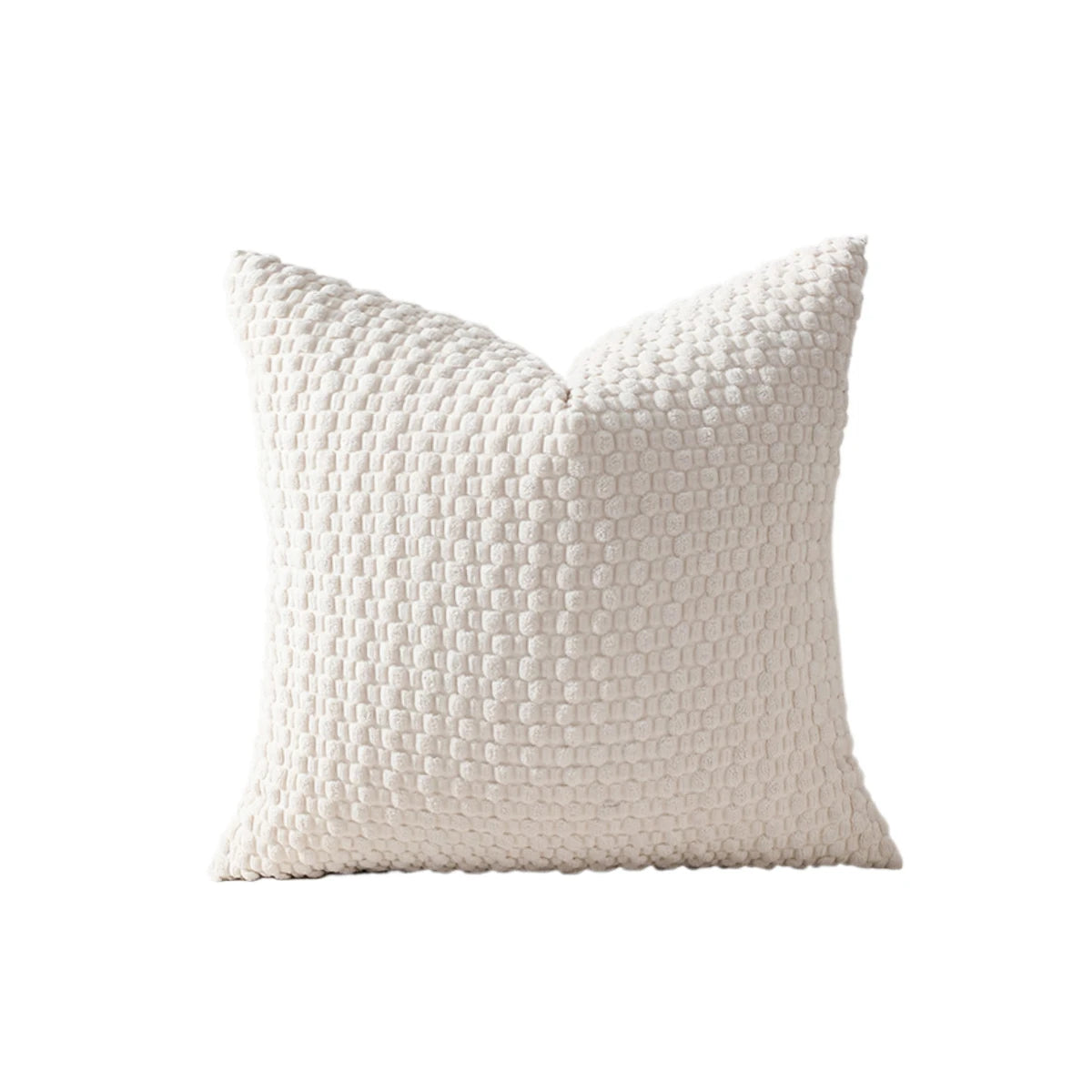 A white, textured pillow cover with a subtle grid pattern.