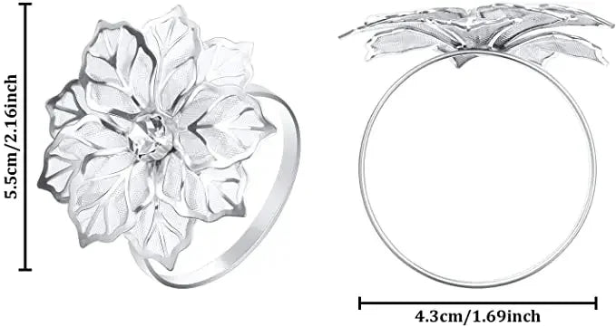 Silver metal napkin rings featuring a detailed floral design and a smooth circular ring.