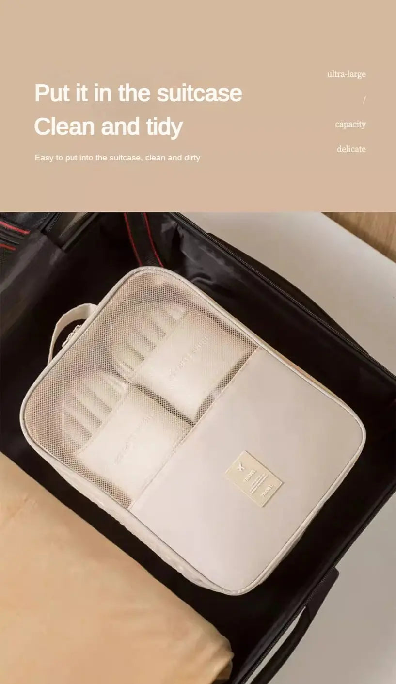 A white portable travel shoe organizer bag is placed inside a black suitcase.