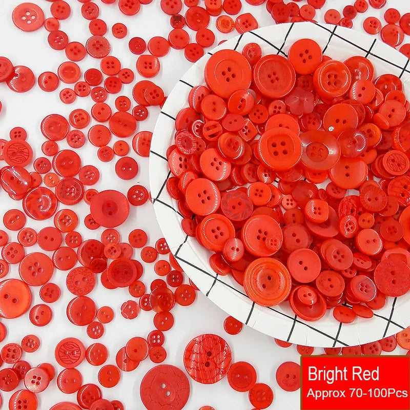A pile of bright red resin sewing buttons scattered on a white surface.