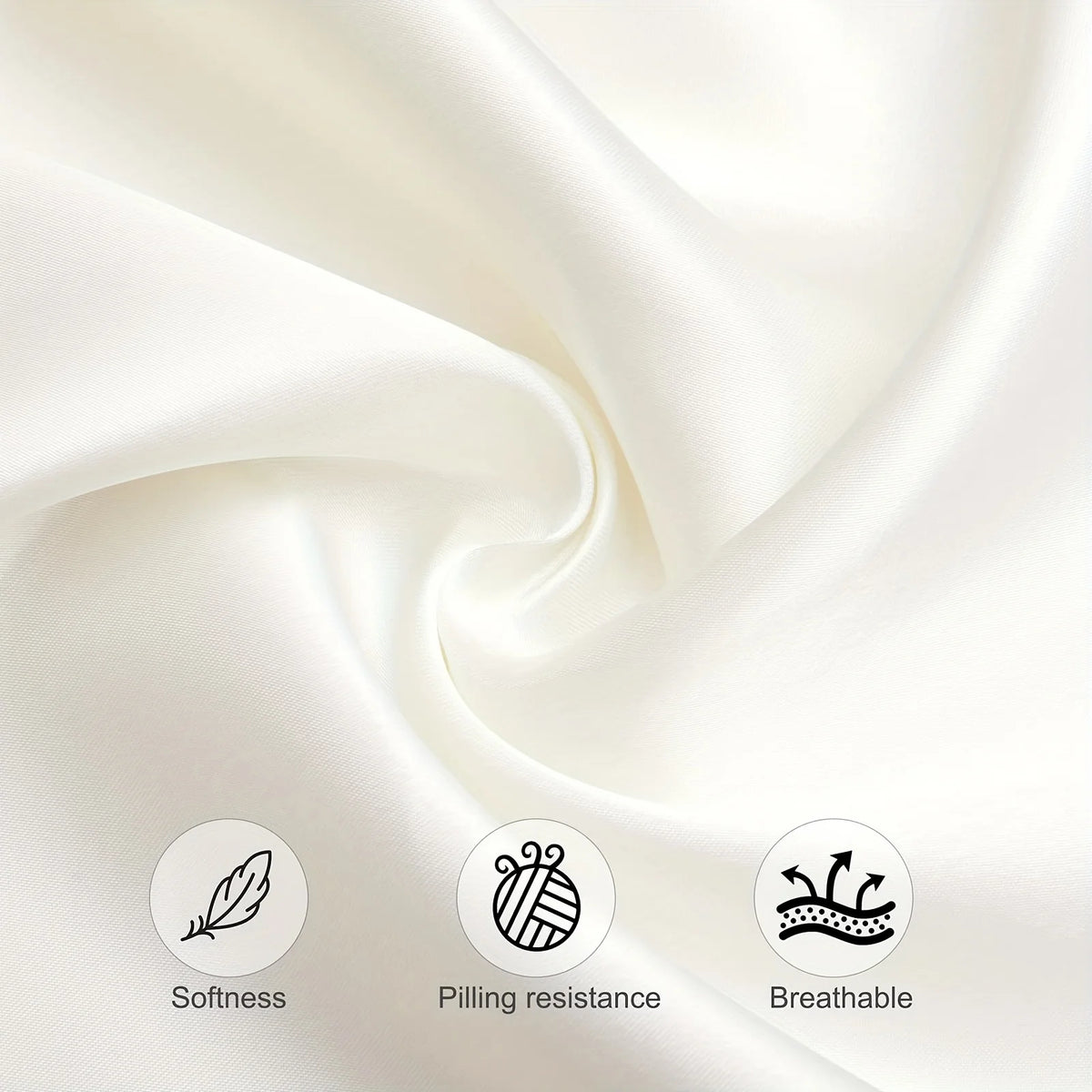 Close-up of smooth, cream-colored silky satin fabric folds showing softness and drape.