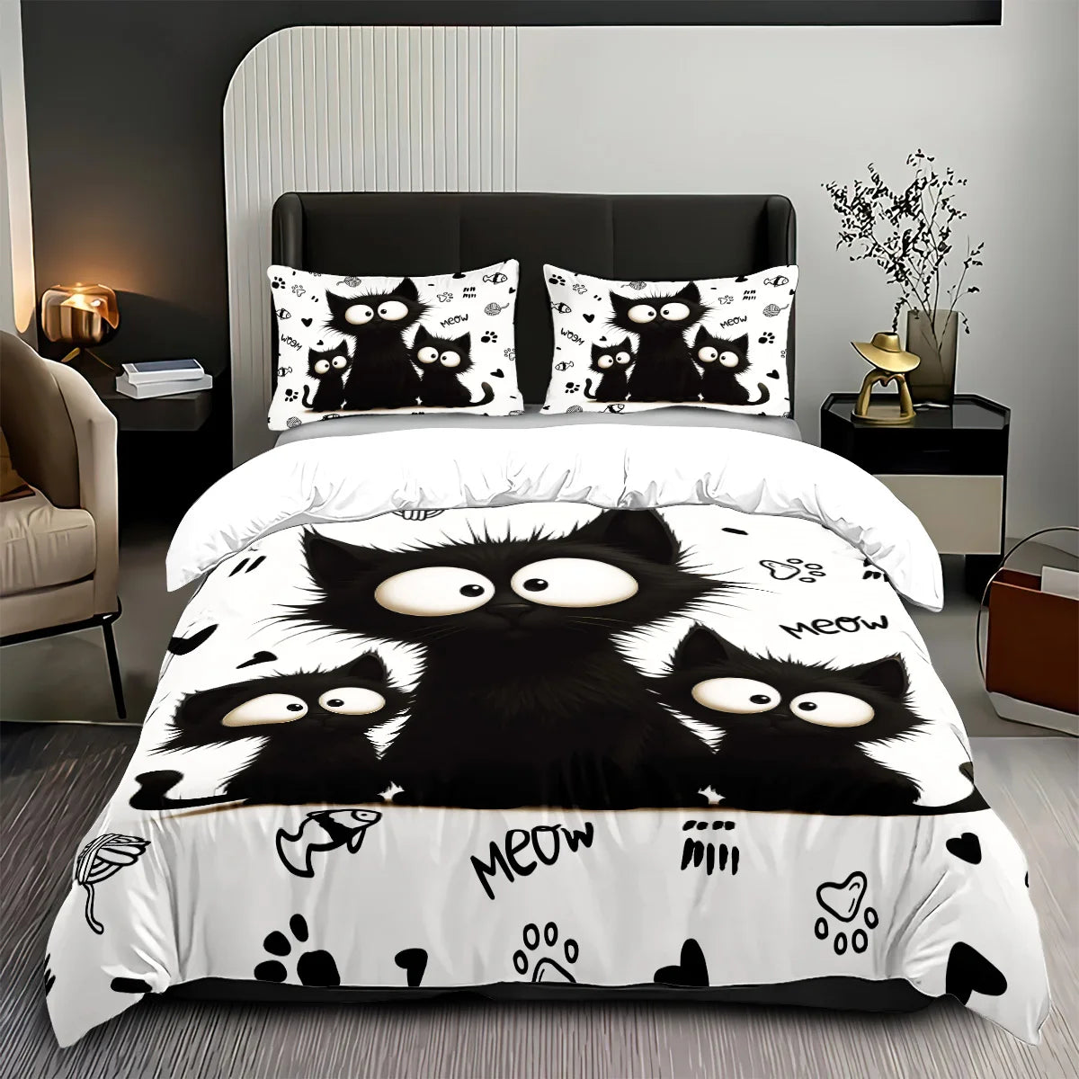 A bedding set featuring a black and white cat print design with multiple cats on the duvet cover.