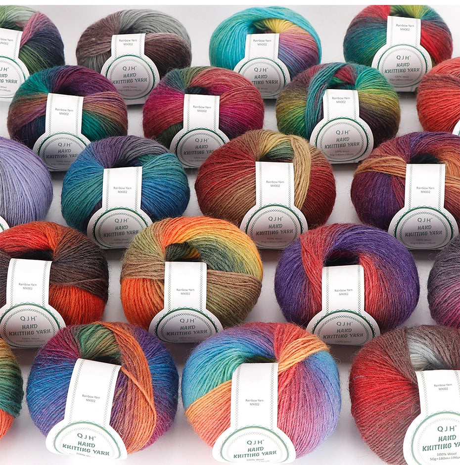 A collection of multi-colored wool yarn skeins in various shades of green, blue, red, and purple for knitting and crocheting